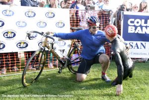 Team Braveheart teammates Robin Williams and Rudy Garcia-Tolson tag up between the swim and bike at the Challenged Athletes Foundation's San Diego Triathlon Challenge at La Jolla Cove